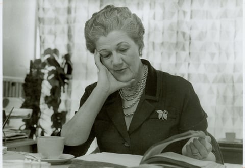 Dorothy Crosland reading at a desk